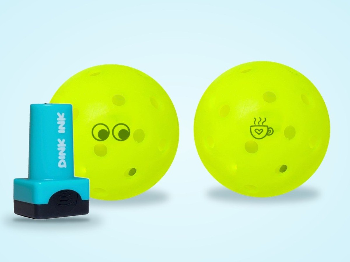 Pickleballs stamped with googly eyes and a coffee cup design
